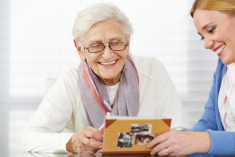 bigstock-Happy-senior-woman-watching-ph-58893359